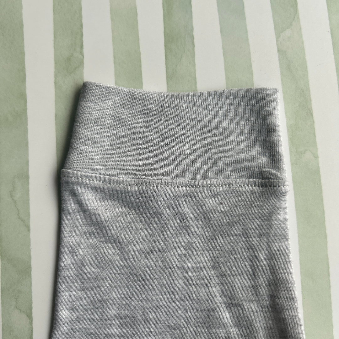 POLO MANGA LARGA COLOR ENTERO GRIS CLARO