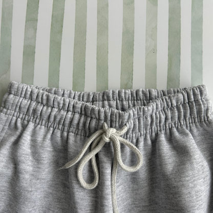 PANTALON BUZO GRIS CLARO