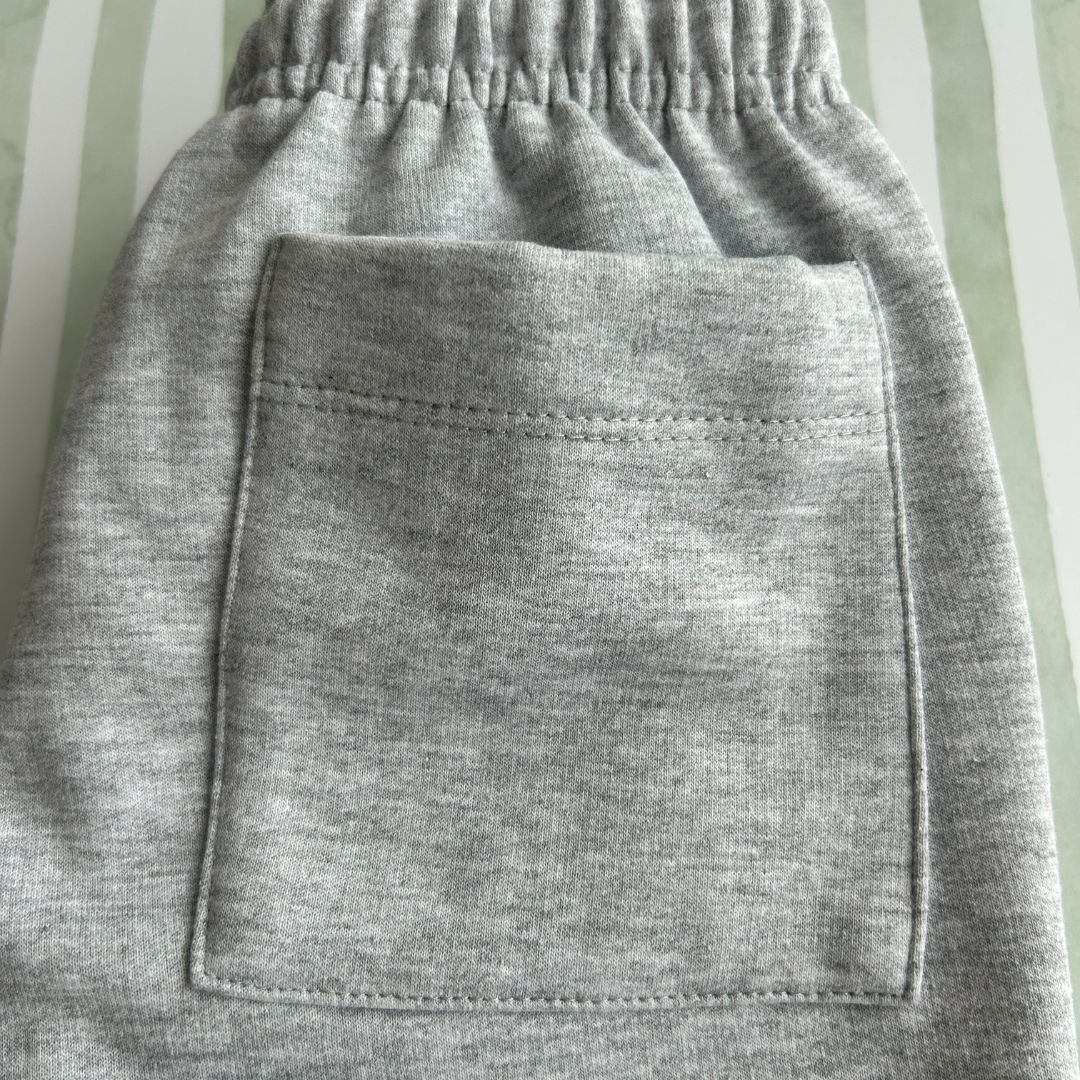 PANTALON BUZO GRIS CLARO